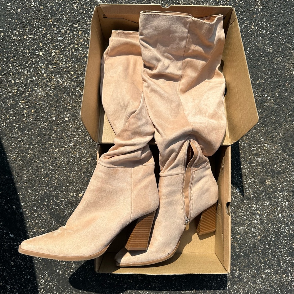 Tall rose colored knee high boots
